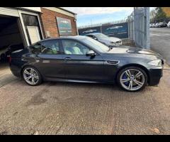 BMW M5 THIS POWERFUL BMW M5 V8 DELIVERS EXHILIRATING PERFORMANCE AND GIVES YOU PRESTIGE AND LUXURY A - 14
