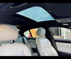 BMW M5 THIS POWERFUL BMW M5 V8 DELIVERS EXHILIRATING PERFORMANCE AND GIVES YOU PRESTIGE AND LUXURY A - 27