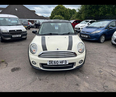 Mini Hatch 1.6 Cooper Hatch finished in White (Manual), 67543 miles with Black Cloth interior,